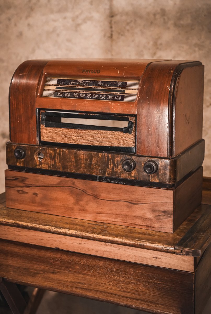 The restored Philco radio cabinet housing the print and sharing station.