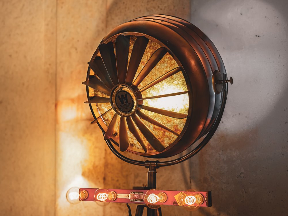 The Salon Sitting's restored Westinghouse industrial lighting fixture.